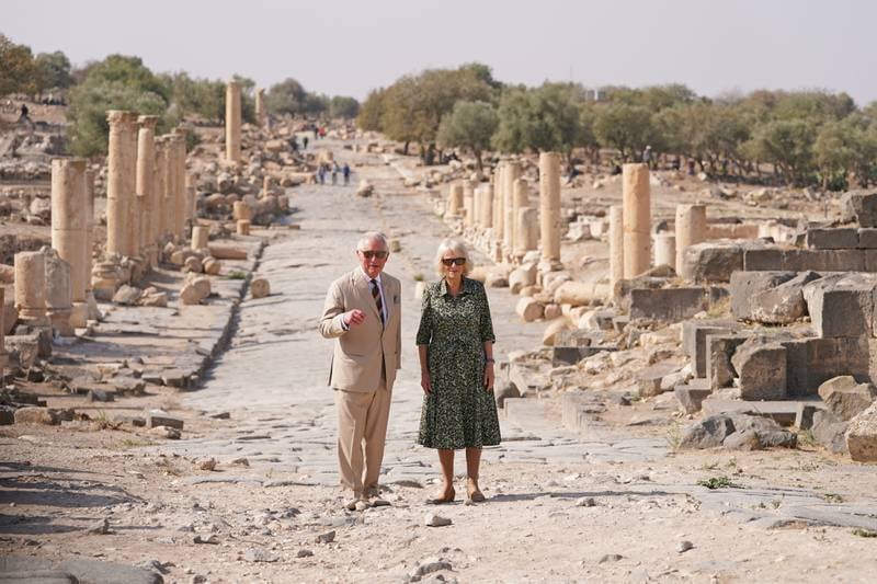 Prince Charles and Camilla on a walking tour of Umm Qais, Jordan, in 2021.