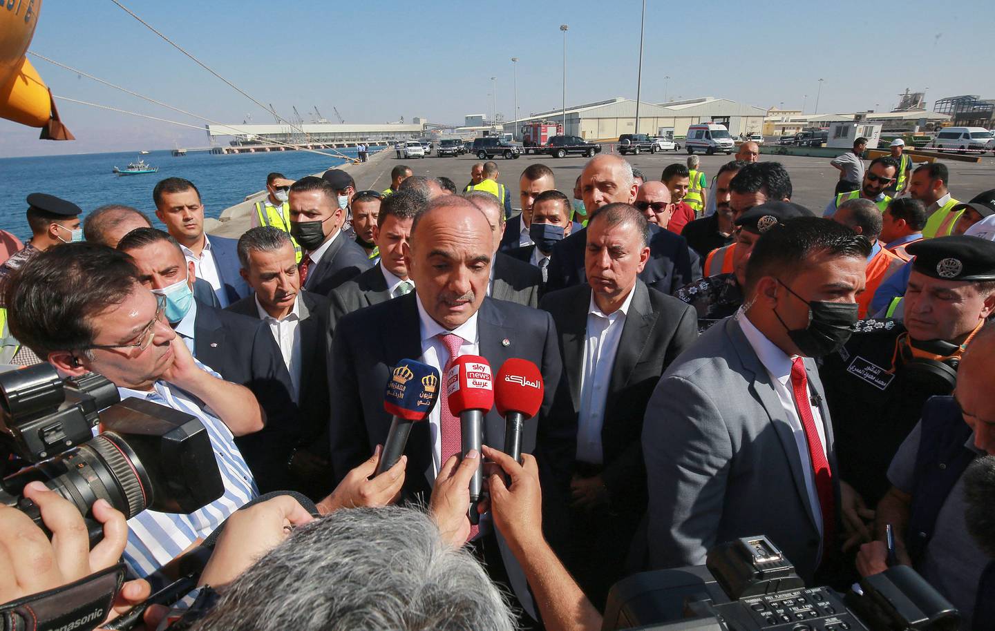 Jordan's Prime Minister Bisher Al Khasawneh talks to reporters as he visits the site of a toxic gas explosion in the Red Sea port of Aqaba on Tuesday. AFP