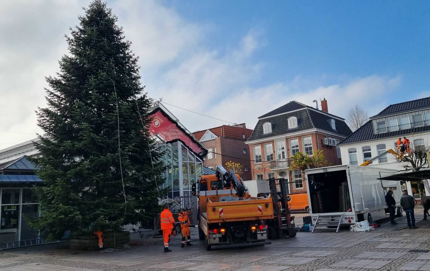 Workers prepare a Christmas market in the town square in Aurich, Germany. Tim Stickings/The National