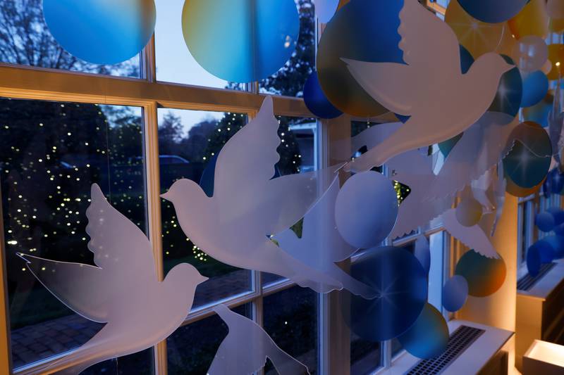 Doves and shooting stars decorate the East Colonnade of the White House. Reuters