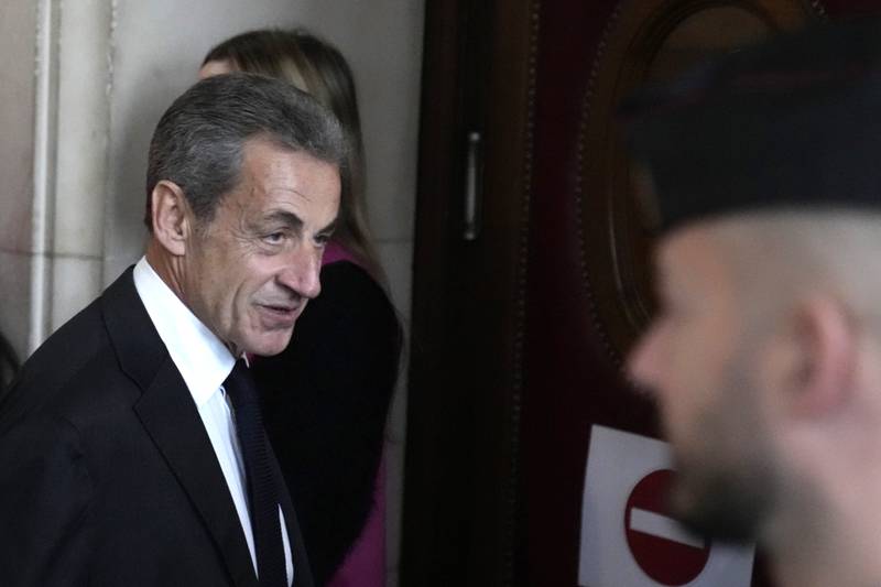 Former French president Nicolas Sarkozy arrives at the courtroom for his appeal. AP