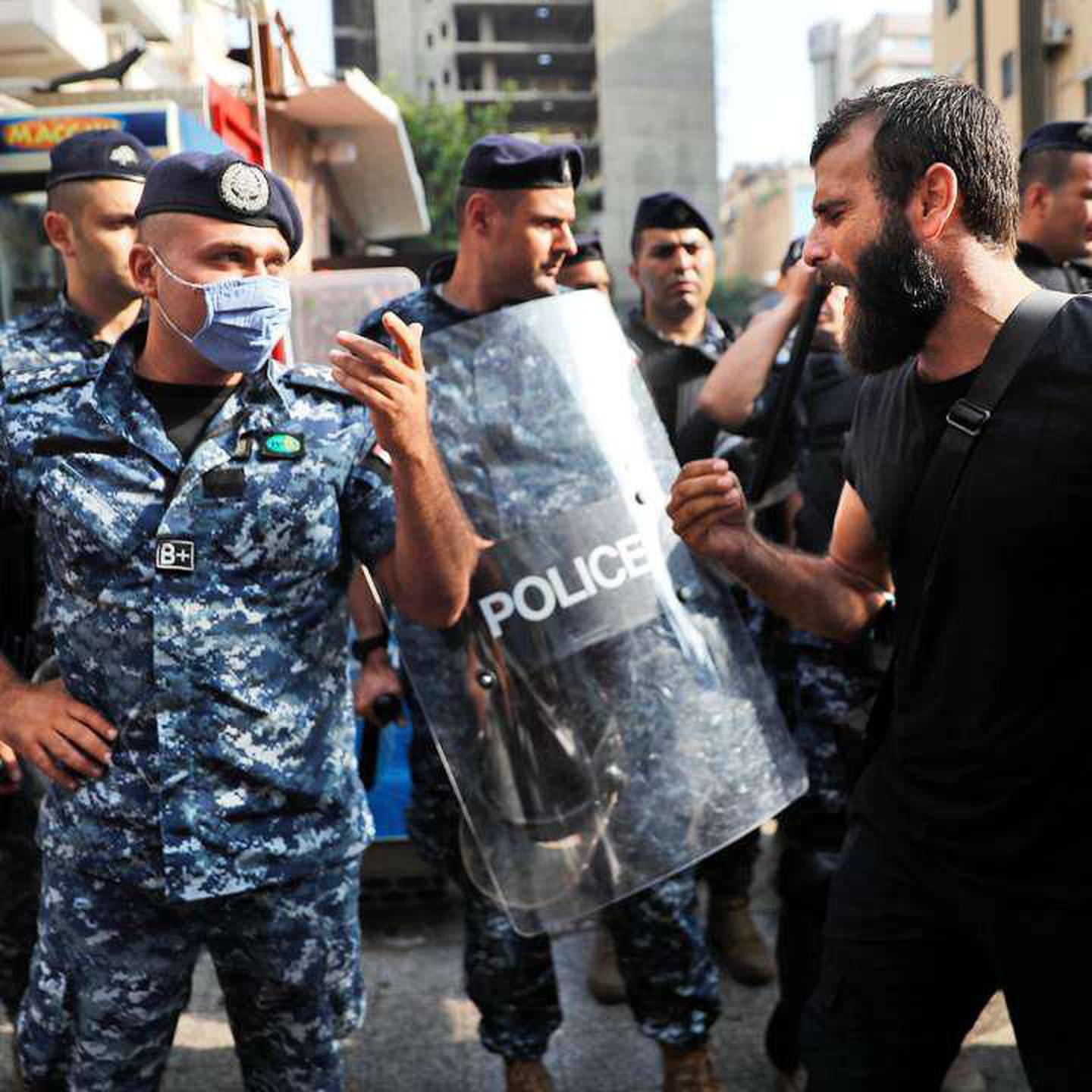 Taymour Jreissati, seen here confronting security forces during protests in Beirut, has now left Lebanon with his family. Toufic Mreity