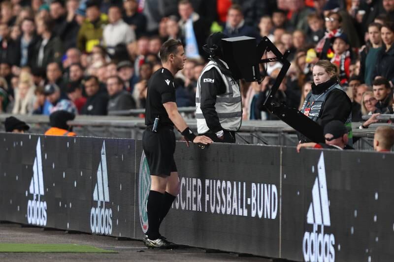 Referee Danny Makkelie checks the VAR screen and awards a penalty to Germany. Getty
