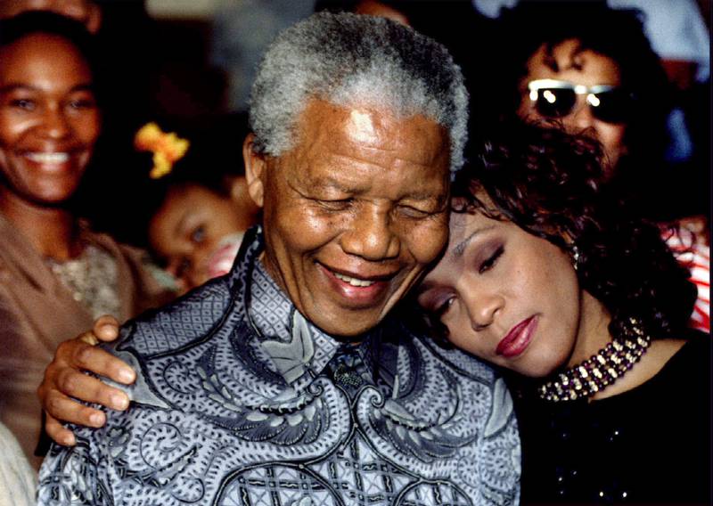 South African President Nelson Mandela and Houston on November 10, 1994. Reuters