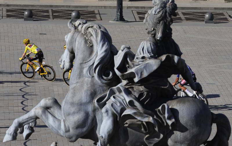 Tour de France winner Jonas Vingegaard rides past the Louvre. AFP