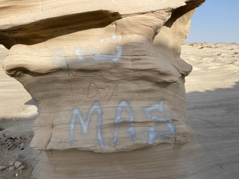 Petrified sand formations at Al Wahtba, Abu Dhabi, formed over thousands of years, have been defaced by graffiti. Courtesy: Hannah Androulaki-Khan