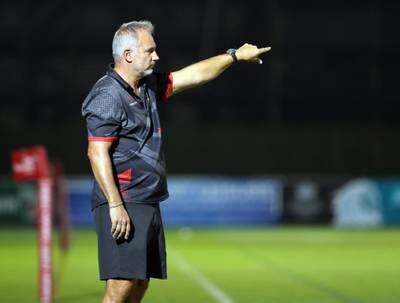 Dubai Exiles head coach Jacques Benade issues instructions on the touchline. 