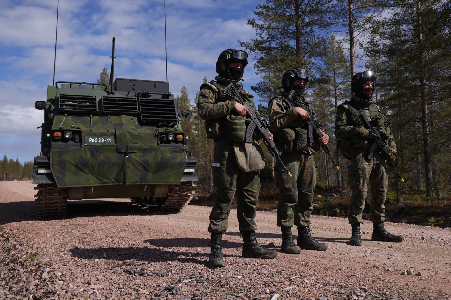 Finnish soldiers stand next to an M270 MLRS heavy rocket launcher during exercises at training grounds near Rovaniemi, in Finland. Getty Images