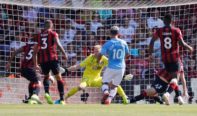 Manchester City's Sergio Aguero scores their third goal. Reuters