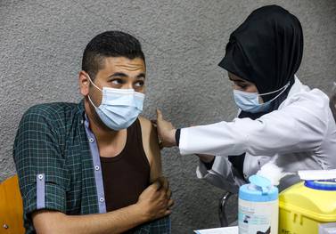 A dose of the Pfizer-BioNTech coronavirus vaccine is given at the Kindi Hospital in Iraq's capital, Baghdad. AFP