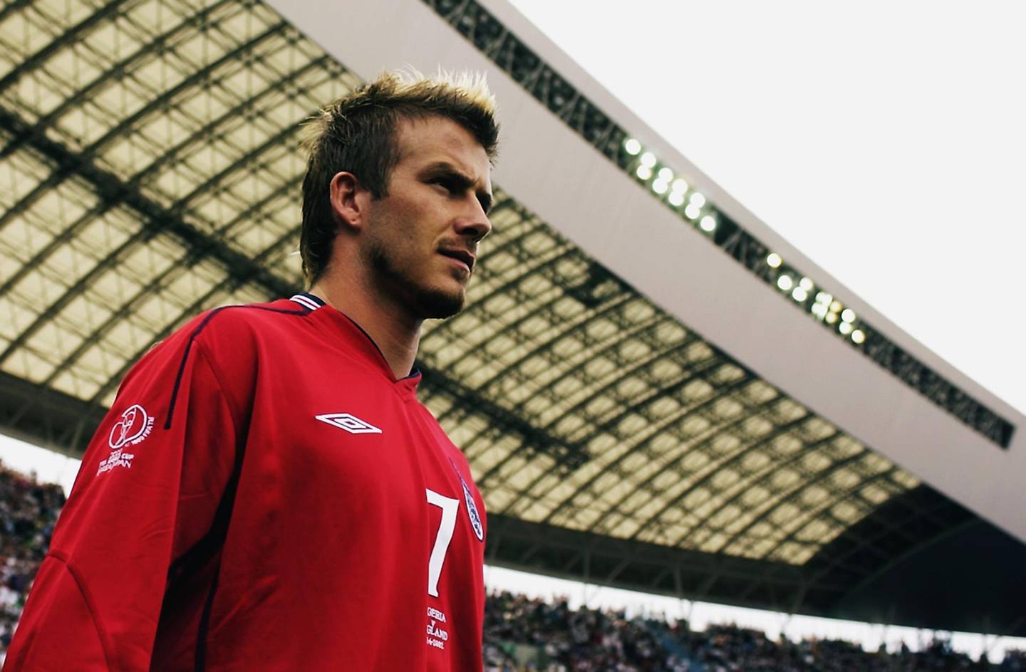 OSAKA - JUNE 12:  David Beckham of England leads the team out before the FIFA World Cup Finals 2002 Group F match between England and Nigeria played at the Osaka-Nagai Stadium, in Osaka, Japan on June 12, 2002. The match ended in a 0-0 draw. DIGITAL IMAGE. (Photo by Ross Kinnaird/Getty Images)