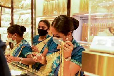 Sales staff at Kanz Jewellers in the gold souq.