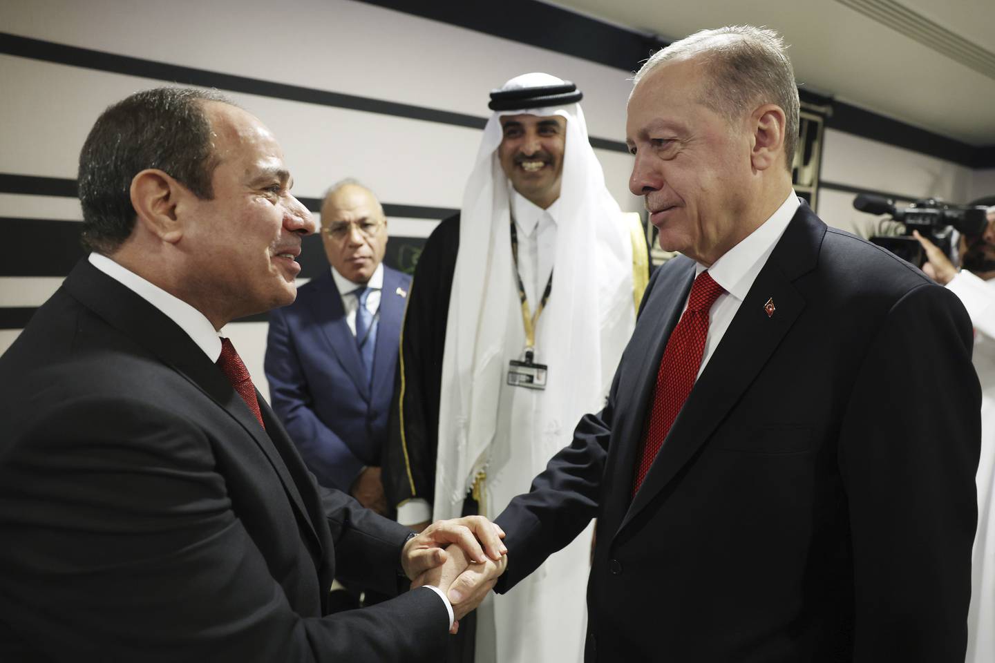 Turkish President Recep Tayyip Erdogan, right, with Egypt's President Abdel Fattah El Sisi at the opening ceremony of the 2022 World Cup in Doha, Qatar, November 20, 2022.  AP