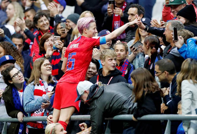 Megan Rapinoe of the US celebrates after the match with fans. Reuters