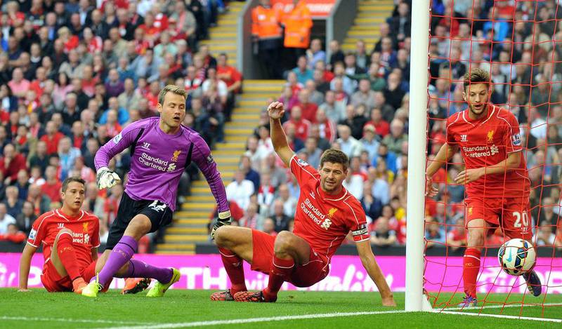 Liverpool goalkeeper Simon Mignolet and midfielder Steven Gerrard can only watch as Agbanlahor, unseen, managed to get a tap-in for the only goal of the game. Paul Ellis / AFP