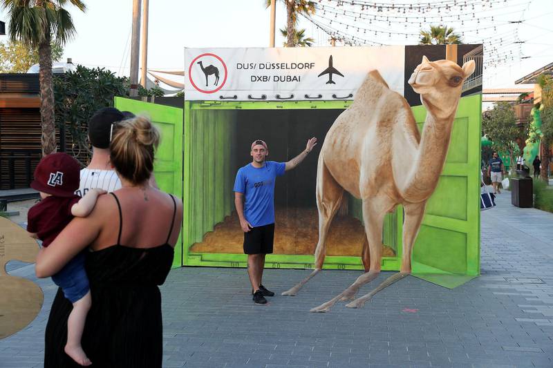 DUBAI , UNITED ARAB EMIRATES , MARCH 6  – 2018 :- People taking photos with 3D art work by Frederike Wouters anamorphic street painting artist from Germany at the Dubai Canvas held at La Mer in Dubai. ( Pawan Singh / The National ) For Arts & Life / Big Picture