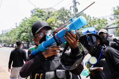 A man holds a makeshift gun in Yangon. Reuters