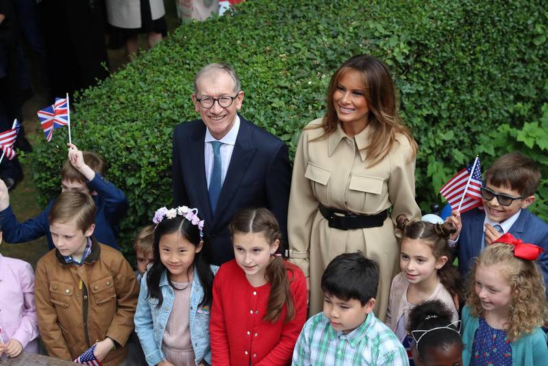 First lady Melania Trump and Theresa May's husband Philip attend a garden party at 10 Downing Street in London. Reuters