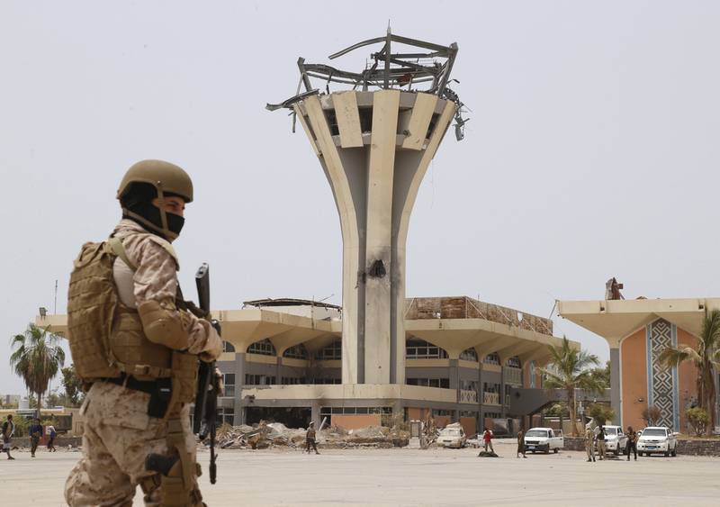 A Saudi soldier stands guard at Aden International Airport on July 24, 2015. The airport was badly damaged in a Houthi missile attack in December 2020. Faisal Al Nasser / Reuters