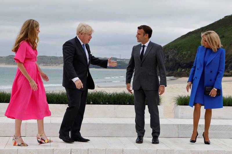 Boris Johnson welcomes France's President Emmanuel Macron to the G7 summit. AFP