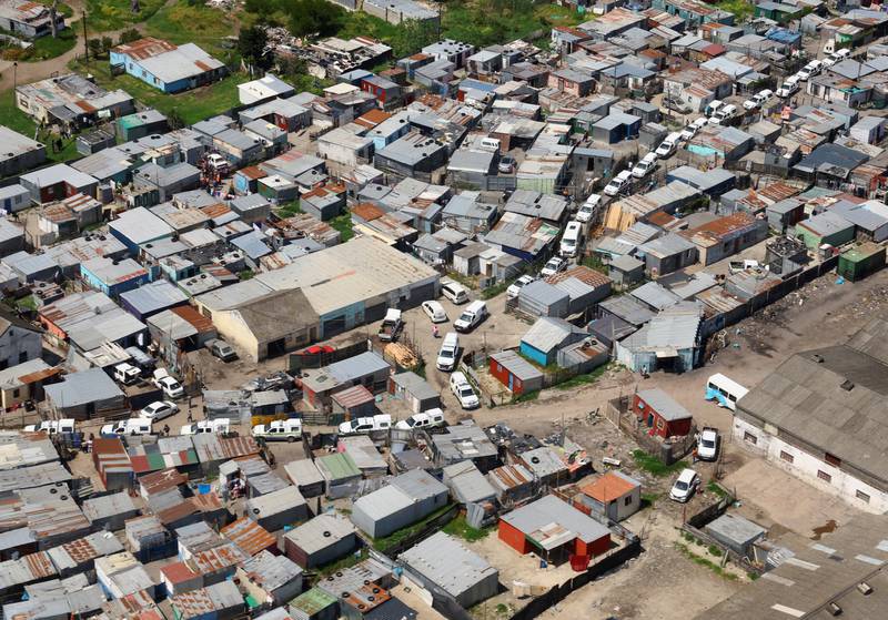 Police and law enforcement vehicles among houses in what the Cape Town mayor's office described as the "biggest anti-crime operation" in the city's history, in which more than 750 law enforcement officers were sent into in the Marikana informal settlement and surroundings, in Cape Town, South Africa. Reuters