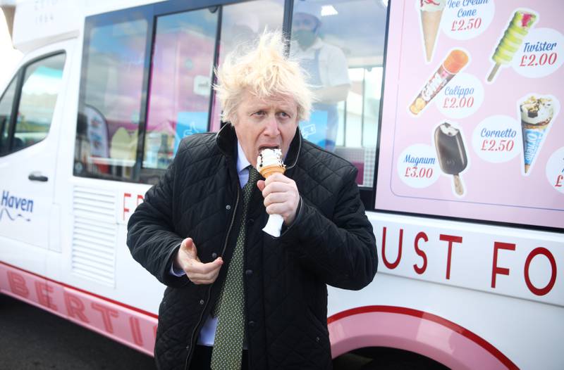 Boris Johnson eats an ice cream during his visit at Haven Perran Sands Holiday Park on April 7, in Perranporth. The prime minister was visiting businesses to see how they were preparing to reopen after the Coronavirus lockdown.