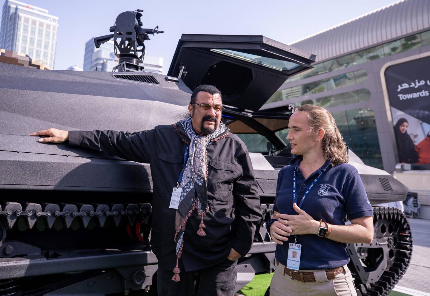 Abu Dhabi, United Arab Emirates, February 23, 2021.  Idex 2021 Day 3. Steven Seagal and Caroline Cresp at the Streit Group stand with the STORM amphibious APC.  Victor Besa / The NationalSection:  NA