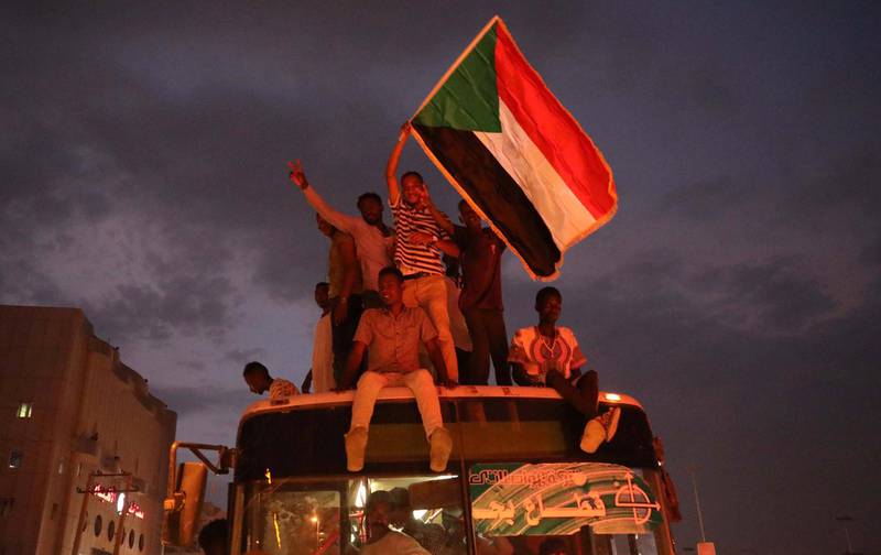 Thousands of Sudanese people celebrate after the signature of the power sharing agreement. EPA/MORWAN ALI