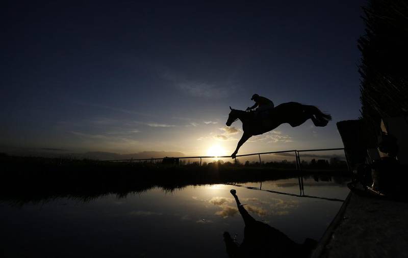 The horse in mid-air represents a step, a change in position, towards the end state of crossing the finish line. Getty Images