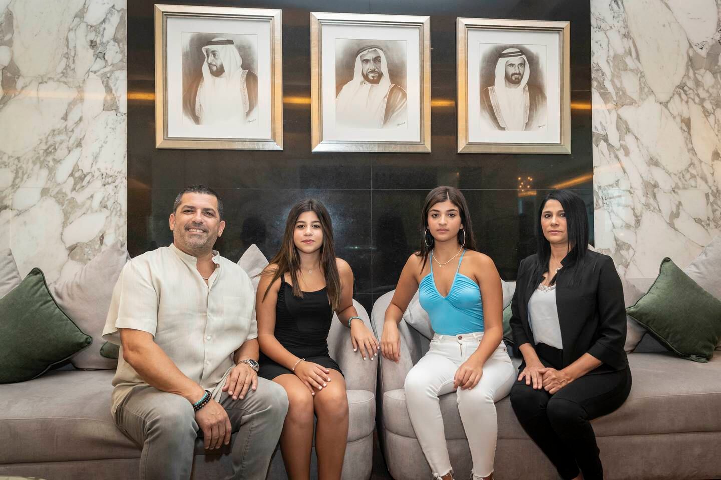 Mr Zamir with his daughters Hila and Shira and wife Hagit Zamir in the lobby of his Dubai apartment. He describes the emirate as the safest place in the world.  Antonie Robertson / The National