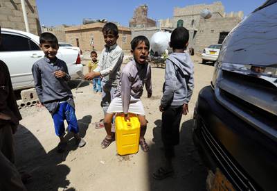 epa07089182 Yemeni children collect drinking water from a donated water tank amid a cholera outbreak in Sanaâ€™a, Yemen, 12 October 2018. According to reports, at least 200 associated deaths and nearly 155,000 suspected cholera cases were reported in Yemen between January and the end of August 2018 due to lack of access to clean water and a shortage of medical supplies.  EPA/YAHYA ARHAB