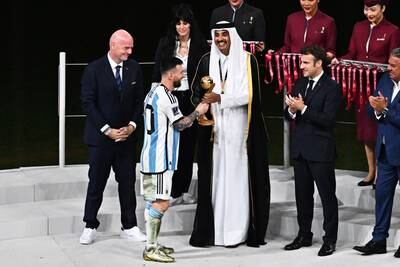 Messi received the award from Sheikh Tamim bin Hamad Al Thani, the Emir of Qatar. Fifa president Gianni Infantino, left, and French President Emmanuel Macron, right, were also on stage. EPA