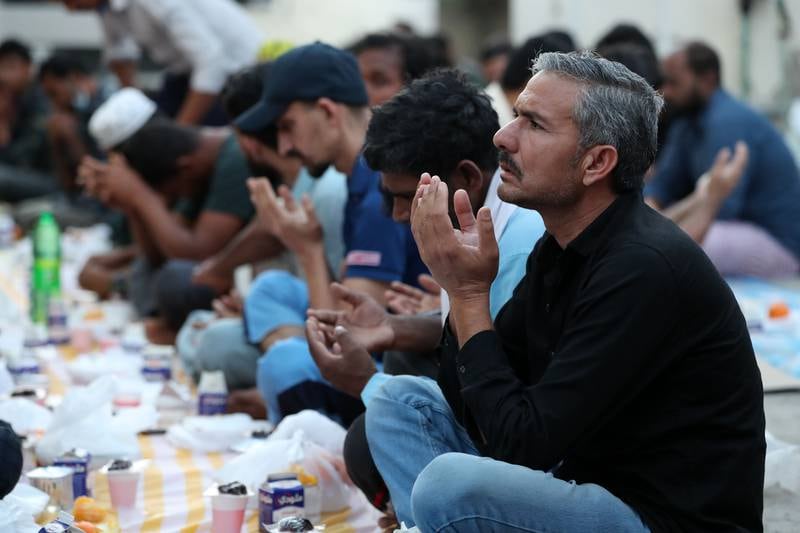 Men pray before iftar on Wednesday, April 27. 