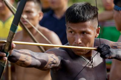 An Embera indigenous man takes part in an archery competition. AP