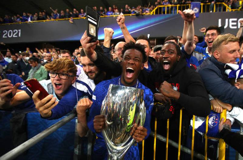 Callum Hudson-Odoi of Chelsea celebrates with the Uefa Super Cup with Chelsea fans.