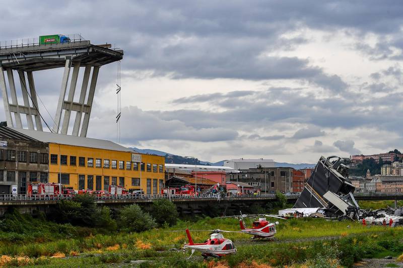 Rescue services attend the scene at the Morandi bridge which collapsed. Getty Images