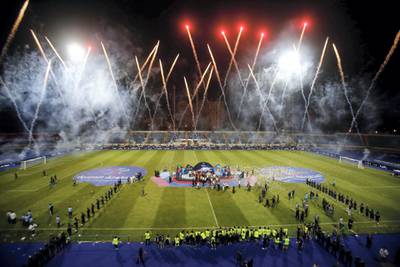 Fireworks during the Tunis’s Esperance players receiving the trophy for their victory over Jordan’s  Al-Faisaly in the final match in Arab Club championship at Alexandria Stadium on August 6, 2017, Tunis’s Esperance team won 3-2.
  / AFP PHOTO / AHMED ABD EL-GAWAD