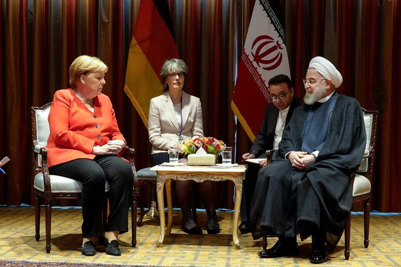 President Hassan Rouhani, right, meets Germany's Chancellor Angela Merkel, left, on the sideline of the United Nations General Assembly at the United Nations Headquarters.  AP