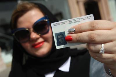 JEDDAH, SAUDI ARABIA - JUNE 24:  Nada Edlibi holds up her Saudi Arabian driver's license on the first day that she is legally allowed to drive in Saudi Arabia on June 24, 2018 in Jeddah, Saudi Arabia. Saudi Arabia has today lifted its ban on women driving, which had been in place since 1957. The Saudi government, under Crown Prince Mohammad Bin Salman, is phasing in an ongoing series of reforms to both diversify the Saudi economy and to liberalize its society. The reforms also seek to empower women by restoring them basic legal rights, allowing them increasing independence and encouraging their participation in the workforce. Saudi Arabia is among the most conservative countries in the world and women have traditionally had much fewer rights than men.  (Photo by Sean Gallup/Getty Images)
