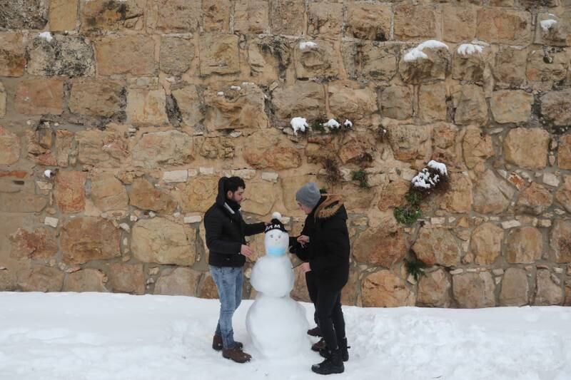 Another snowman after a snowstorm near the Jaffa gate. EPA