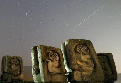 A meteor streaks past stars in the night sky above the Necropolis for the victims of Fascism, in Novi Travnik, Bosnia and Herzegovina. Reuters