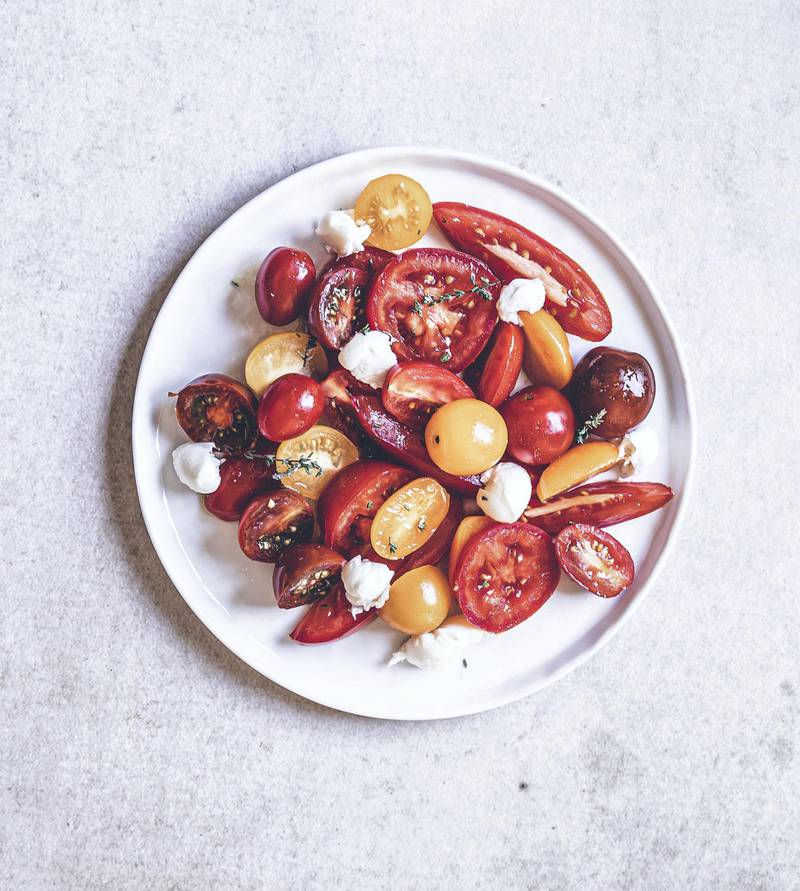 Salad with cherry tomatoes, candy tomatoes and vine tomatoes with cheese. Photo: Scott Price