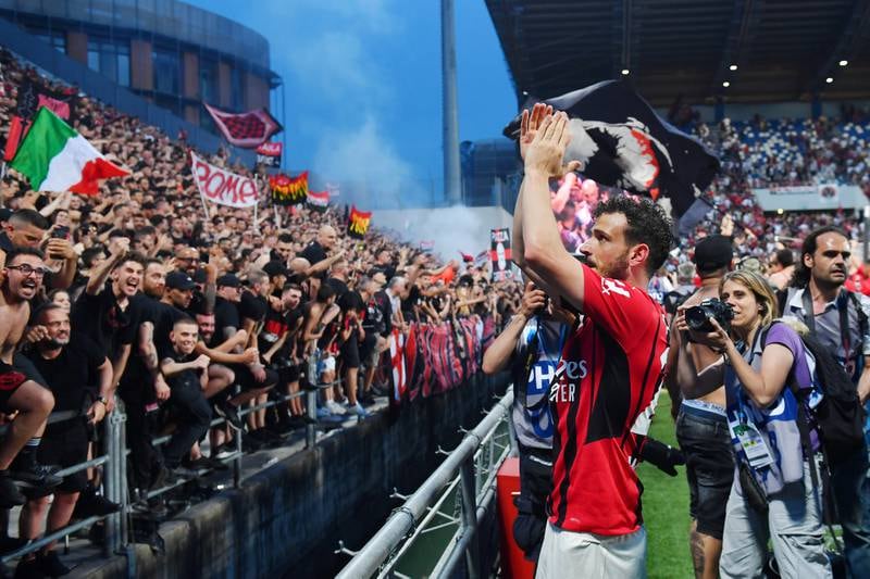 Alessandro Florenzi celebrates with the fans after AC Milan won the Serie A title. Getty
