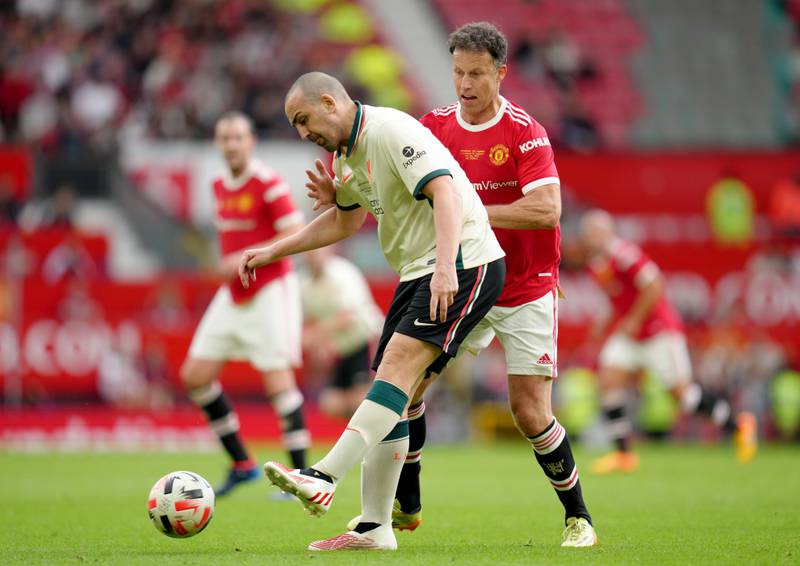 Manchester United's Ronny Johnsen battles for the ball with Jose Enrique during the legends match at Old Trafford, Manchester. PA