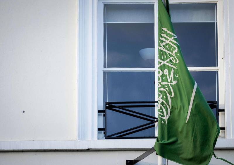 Forensics police officers investigate the Embassy of Saudi Arabia in The Hague after it was shot. AFP, ANP