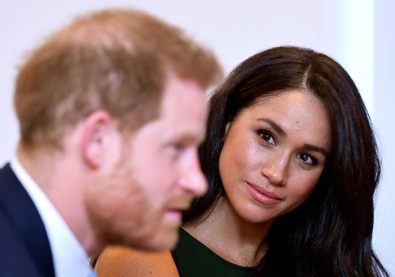 FILE PHOTO: Meghan, Duchess of Sussex, looks at Britain's Prince Harry during the WellChild Awards pre-Ceremony reception in London, Britain, October 15, 2019. REUTERS/Toby Melville/Pool/File Photo