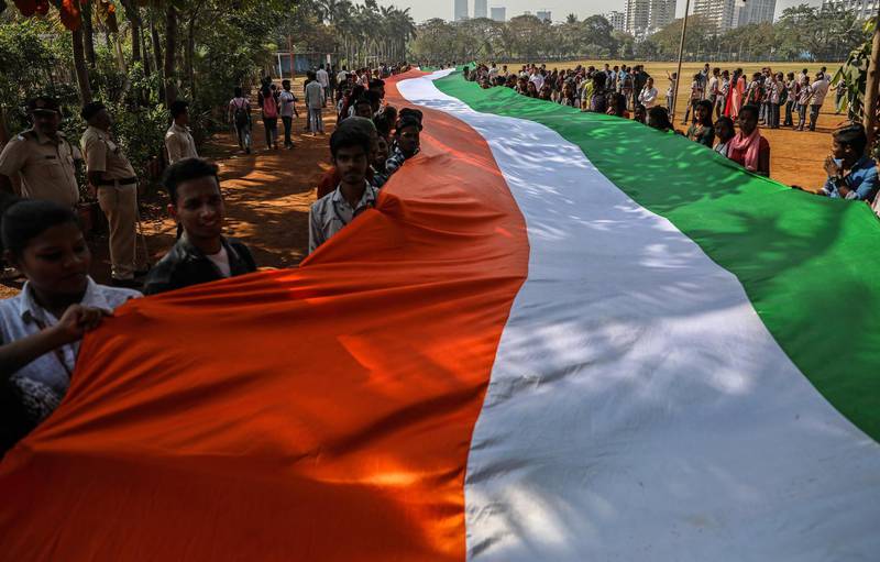 Students hold portion of the 352-metre long Indian national flag during a rally ahead of Republic Day, in Mumbai, India. EPA