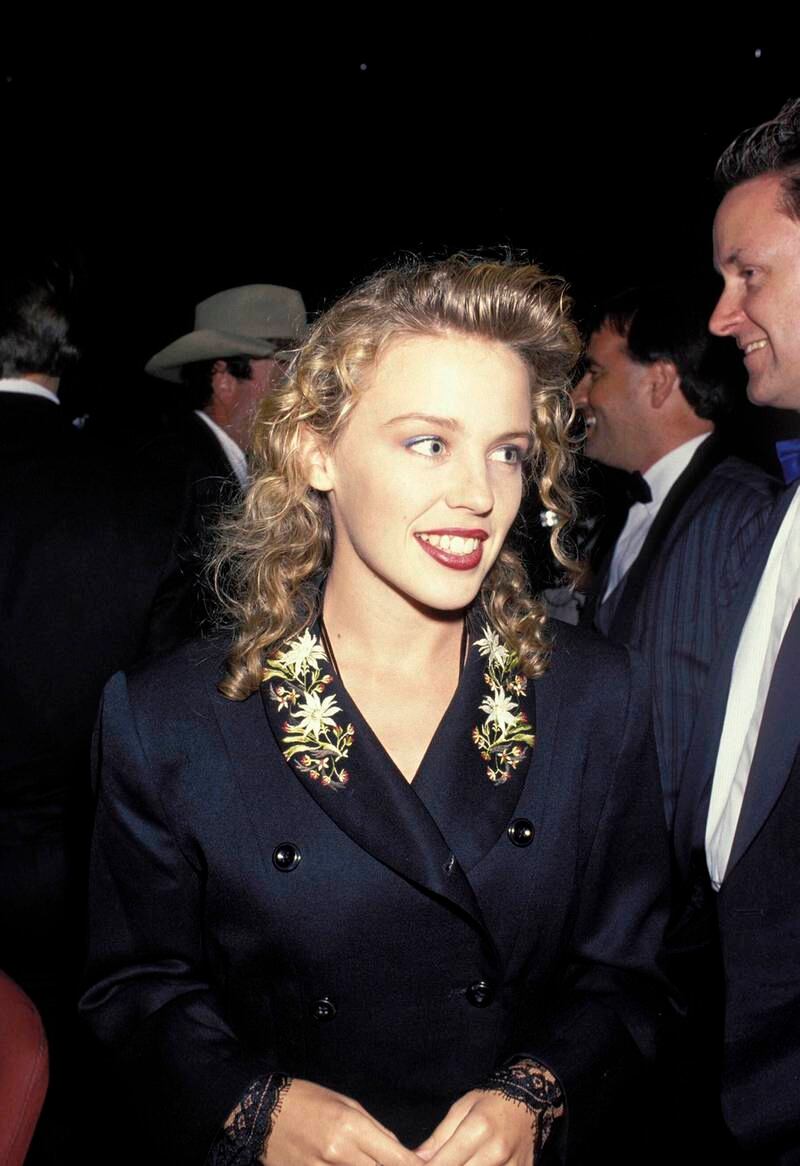 Kylie Minogue, in a gold-embroidered satin jacket, attends the Aria Awards in Sydney, Australia, on March 6, 1989.