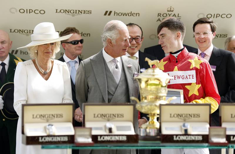 Shane Crosse receives a trophy on the podium from Prince Charles and Camilla after winning the 3.40pm Prince Of Wales’s Stakes. Reuters