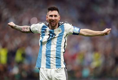 Lionel Messi celebrates scoring Argentina's third goal. PA